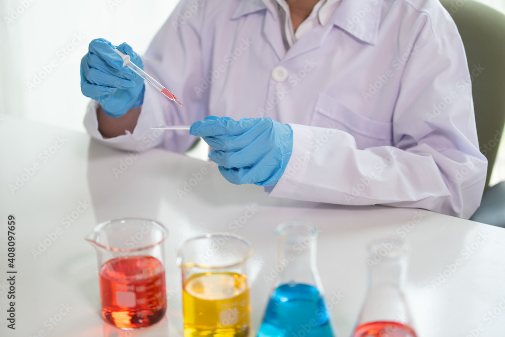 Scientist drop a sample on glass slide in medical laboratory, Science and chemistry, Researcher test a sample concept Scientist drop a sample on glass slide in medical laboratory, Science and chemistry, Researcher test a sample concept
