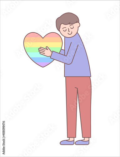 Young man holding a rainbow-coloured heart / Young man who appreciates people who are fighting the Covid-19 