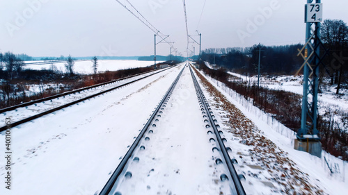 Point of view from the train locomotive. Train transport during the winter. High quality photo