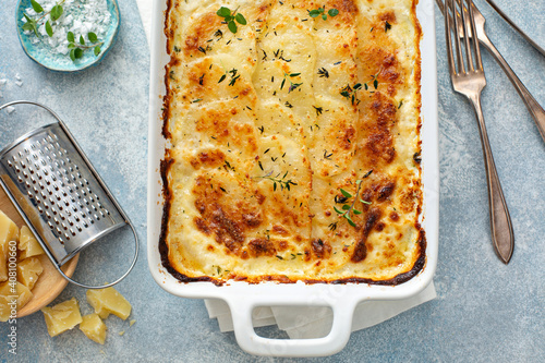 Cheesy scalloped potatoes with thyme and parmesan