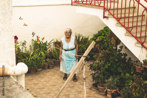 Italian Grandma in front of her house