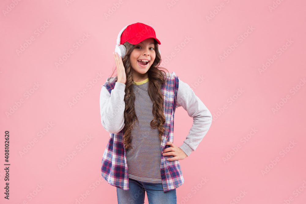 happy teenager girl with hipster look in modern earphones, volume quality happy teenager girl with hipster look in modern earphones, volume quality