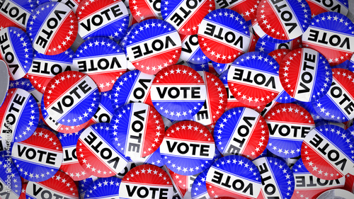 Patriotic USA Election Vote Buttons in a Pile.  Pins feature stars and stripes theme in red white and blue. photo