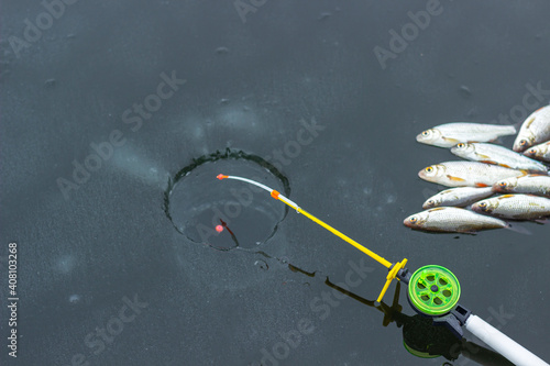 ice fishing, ice fishing rod and fish on ice