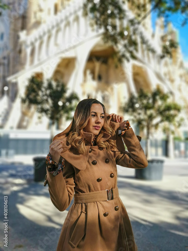 Woman posing in the city for some portrait photos, wearing casual spring clothes. © Andrea