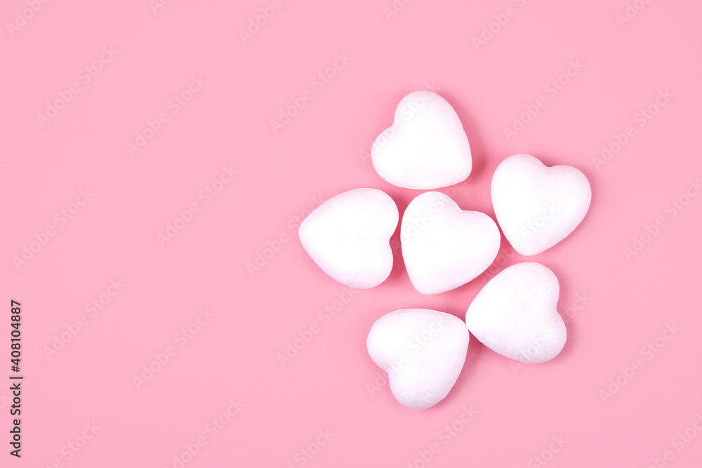Some white hearts on a pink background Some white hearts on a pink background