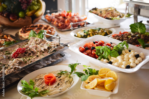 Buffet with fresh dishes, fruits and veggies