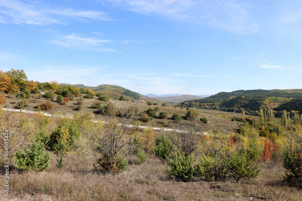 Beautiful autumn landscape with colorful trees and mountains in Crimea