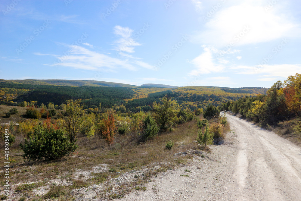 beautfiul view of mountain road in autumn with colorful forest beautfiul view of mountain road in autumn with colorful forest