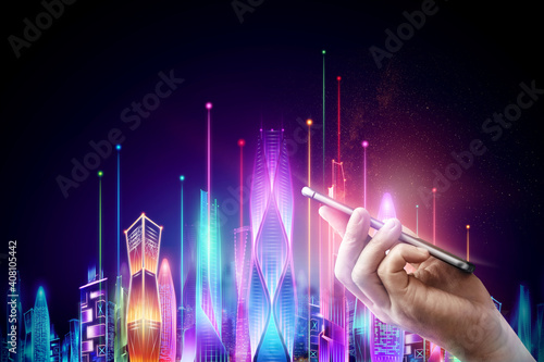 Male hand holding a smartphone on the background Hologram smart city night neon on a dark background, big data technology concept.