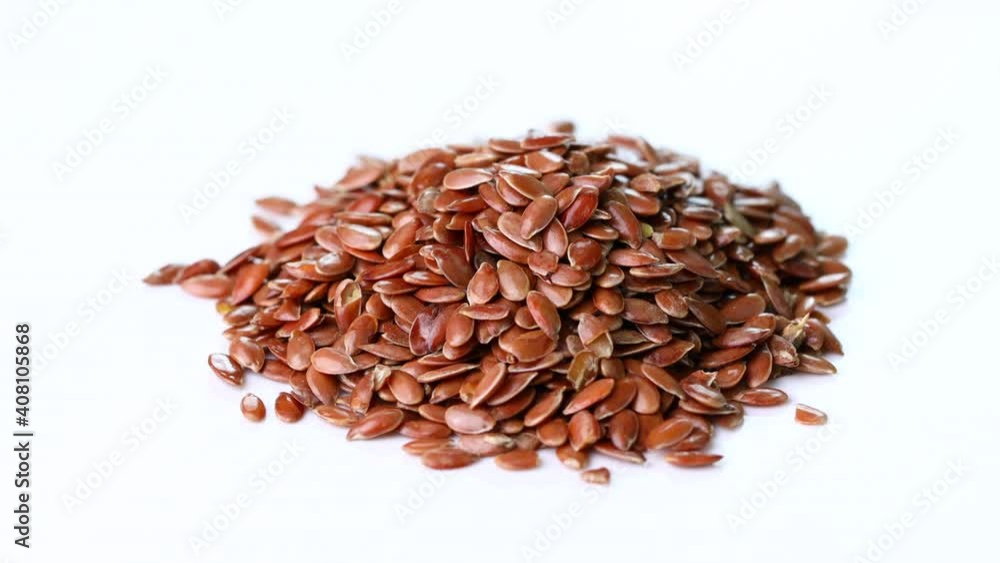 rotation flax seeds on white background