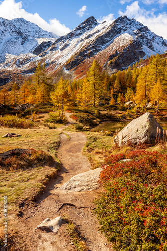 Arpy Lake and the surroundings area during the fall and changing of the colors. Foliage, reflection and snowy peaks. photo