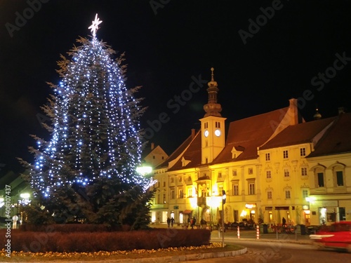 Slovenia, Maribor, christmas tree in Glavni trg main square at night