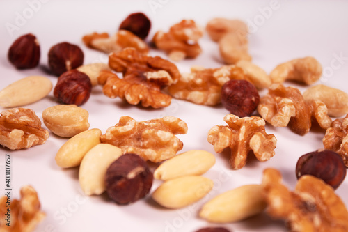 hazelnuts, cashews, walnuts and almonds are mixed with each other at an angle