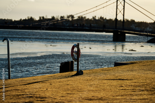 Outdoors at Kalvøya, Sandvika, Bærum, Norway. Ice cold winter day, but the sun is shining and is heating a little bit.  photo