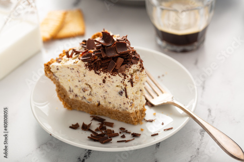 Ricotta and chocolate Cannoli pie, italian inspired dessert topped with chocolate curls photo