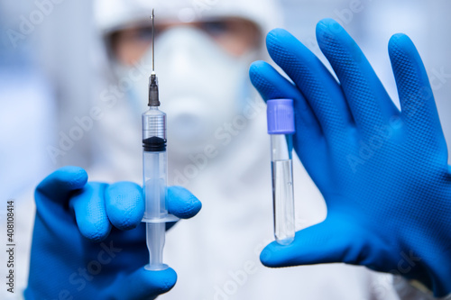 Health worker dials vaccine into syringe. Concept vaccination people for coronavirus Covid.