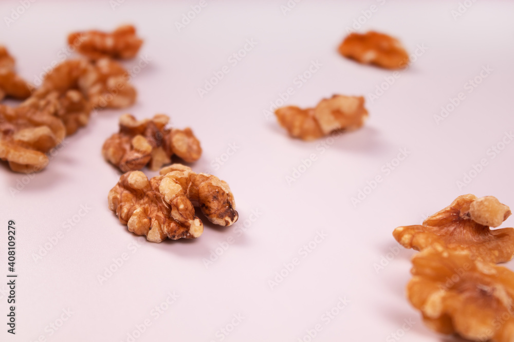 a small amount of shelled walnuts scattered across the frame a small amount of shelled walnuts scattered across the frame