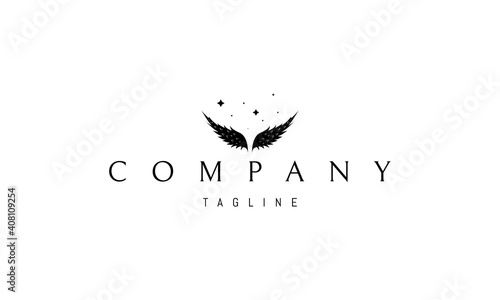 Vector logo on which an abstract image of angel wings on a background of stars.