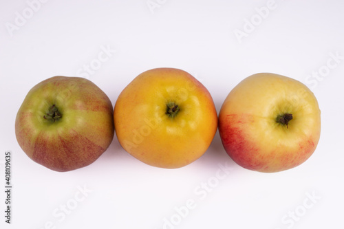 top view of inverted apples of different colors