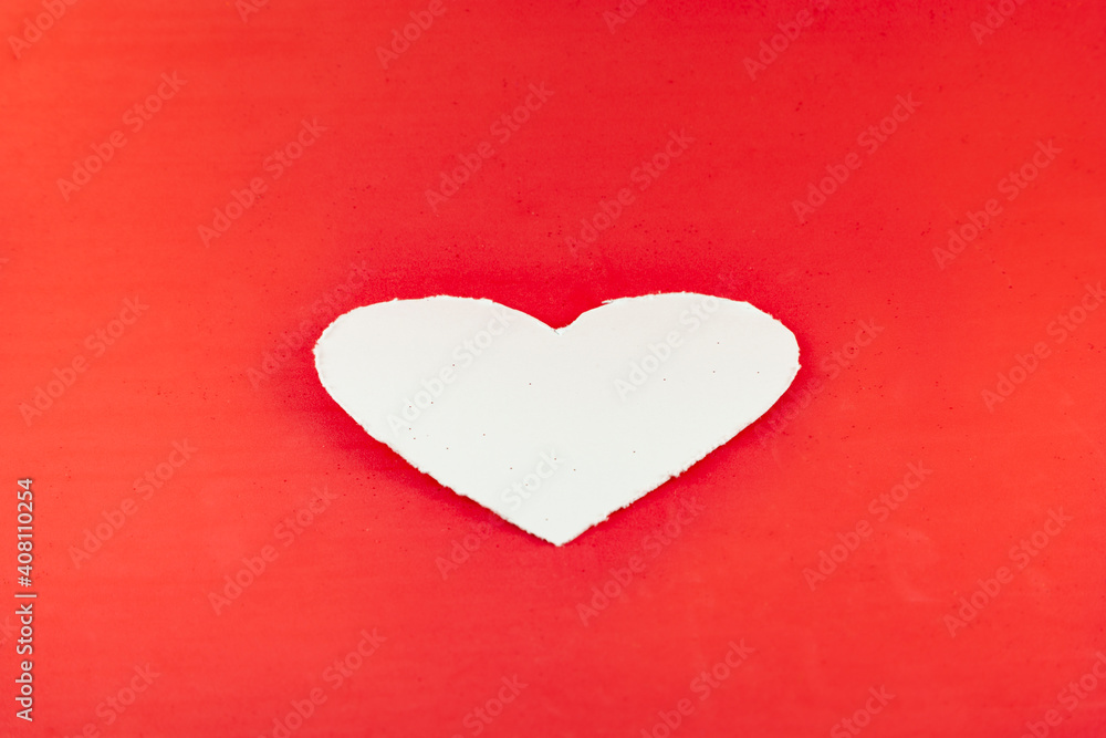 White heart on red background