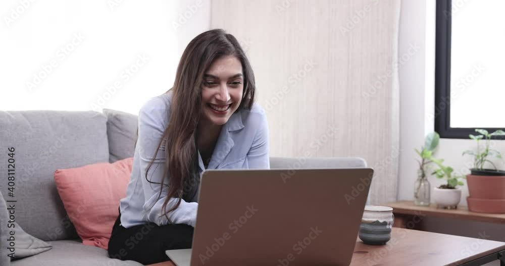 Asian freelance businesswoman uses a laptop computer to work at home, Video conference with friends or clients, She felt happy when her job was accomplished. Asian freelance businesswoman uses a laptop computer to work at home, Video conference with friends or clients, She felt happy when her job was accomplished.
