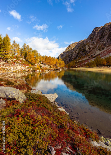 Arpy Lake and the surrounding area during the fall and changing of the colors. Foliage, reflection and snowy peaks