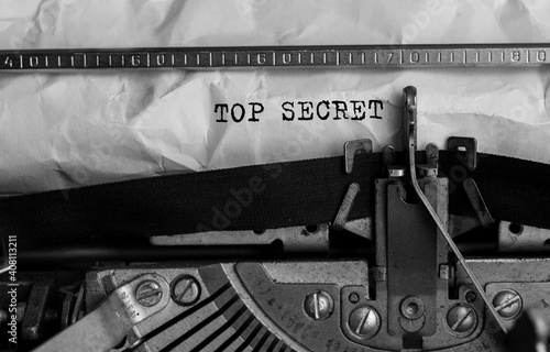 Text Top Secret typed on retro typewriter photo