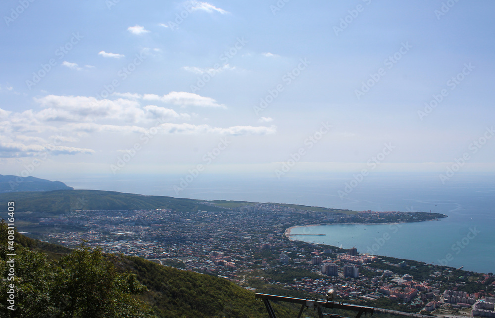 Picturesque view from the mountain to the sea and the city