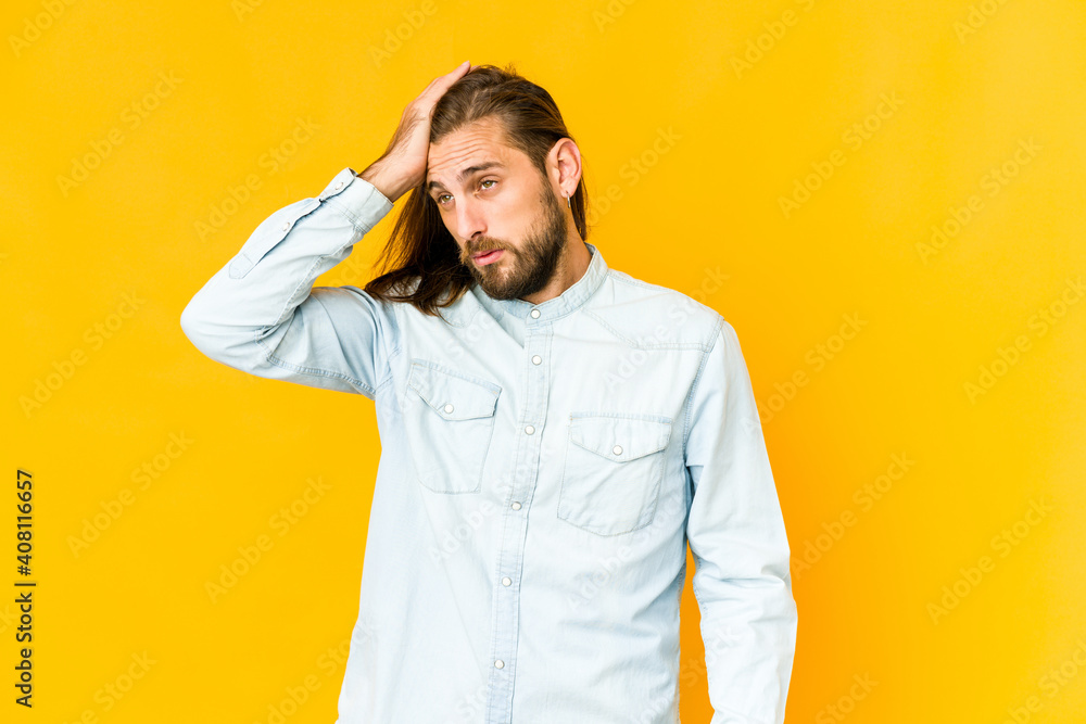 Young man with long hair look forgetting something, slapping forehead with palm and closing eyes. Young man with long hair look forgetting something, slapping forehead with palm and closing eyes.