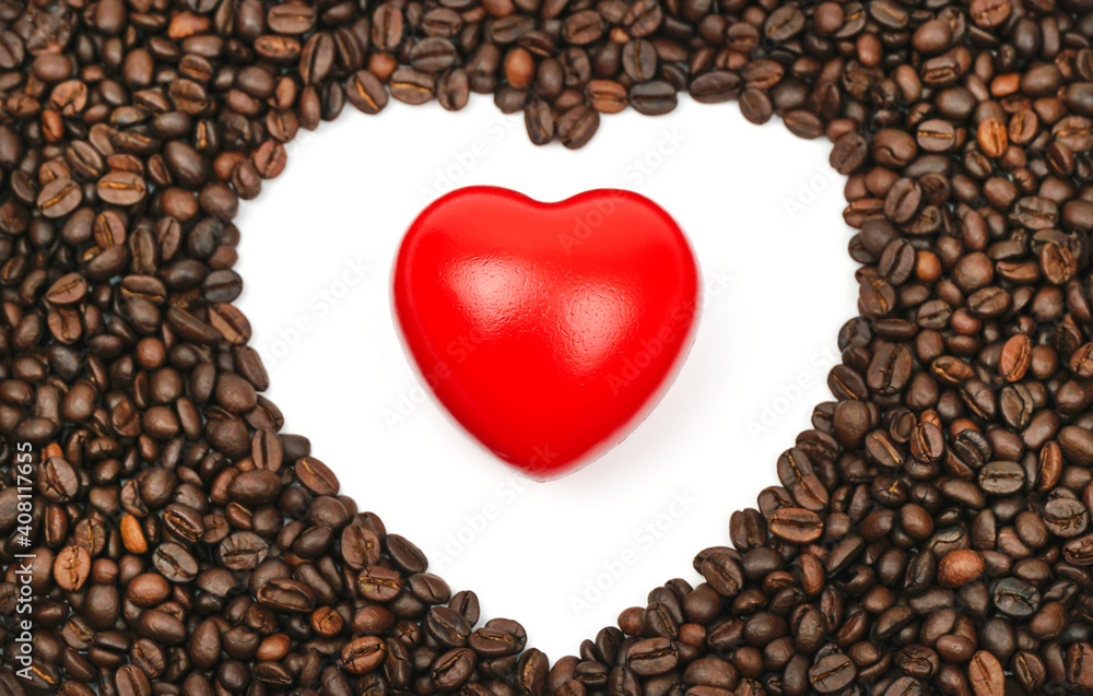 Red heart with Blurred roasted coffee beans on a white background. Red heart with Blurred roasted coffee beans on a white background.