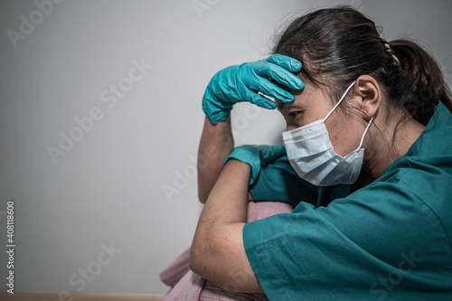 Close up asian doctor woman wear mask for protect covid-19 virus,She sad and stress about work a lot
