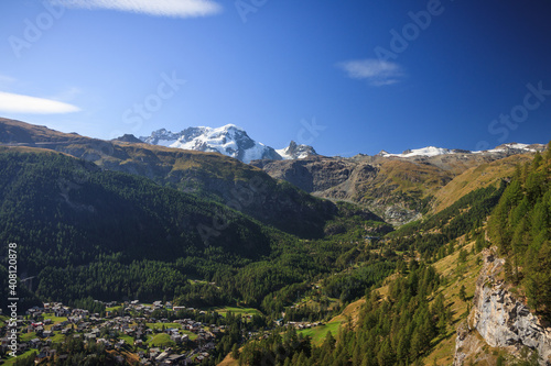 Zermatt in the swiss alps wallis with trees forest wood sunlight matterhorn view path © Thomas