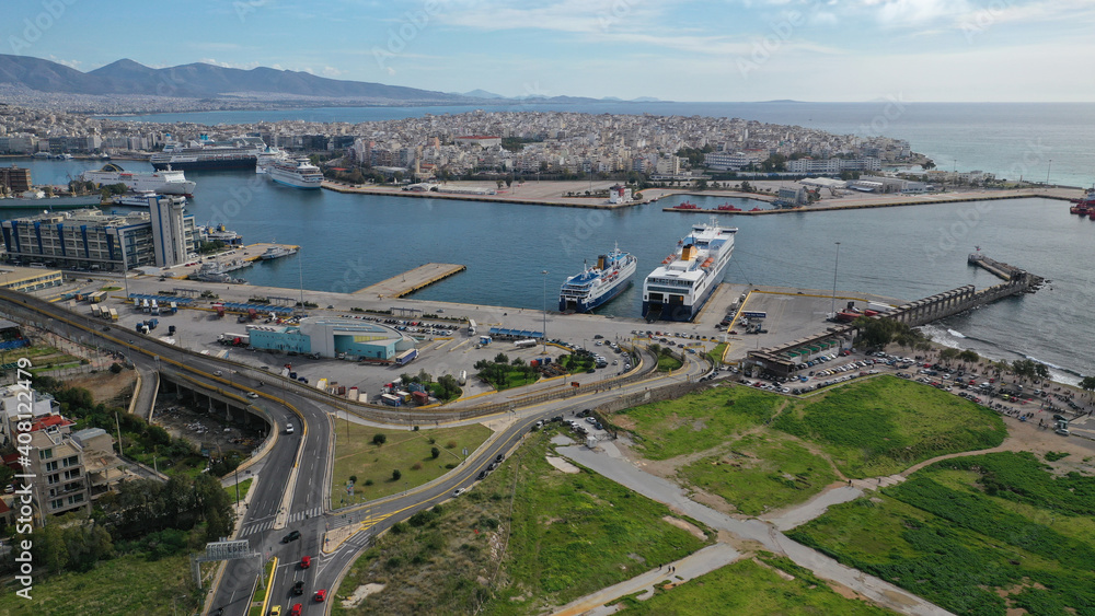 Aerial drone photo of busy port of Piraeus, the largest in Greece and one of the largest passenger ports in Europe as seen from old fertiliser factory, Attica, Greece 