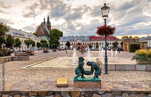 Fototapeta Naklejka Na Ścianę i Meble -  Panoramic view of Olkusz market square with St. Andrew Basilica and statue of historic Miners in Beskidy mountain region of Lesser Poland
