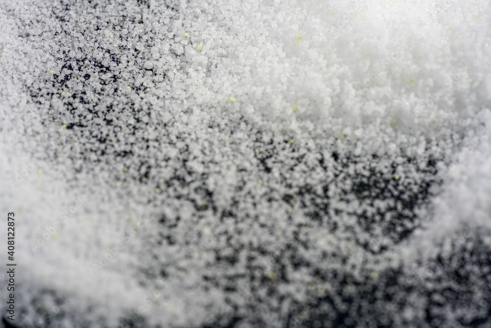 Makrogol powder photographed against a black background in the studio Makrogol powder photographed against a black background in the studio