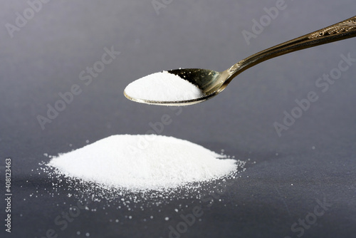 Makrogol powder photographed against a black background in the studio photo