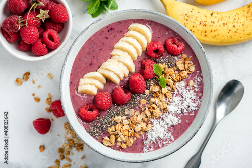 Vegan Acai Smoothie Bowl With Toppings Banana Raspberry Granola Coconut. Top view