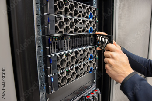 Hands Of Male Technical Consultant Working with Hyperconverged Environment Datacenter photo