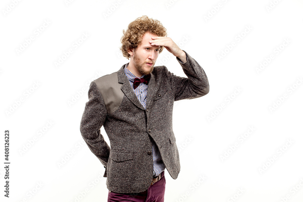 Portrait of elegant puzzled businessman in bow-tie with hand on forehead looking away. isolate Portrait of elegant puzzled businessman in bow-tie with hand on forehead looking away. isolate