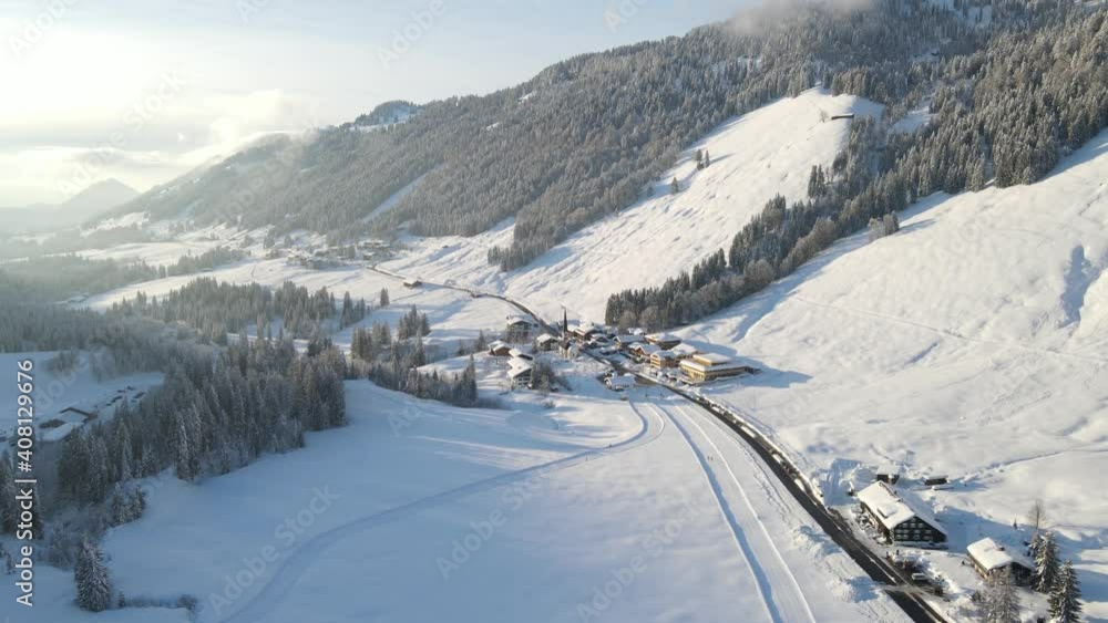 Winter Snow Covered Town Of Balderschwang In Bavaria, Germany. - aerial Winter Snow Covered Town Of Balderschwang In Bavaria, Germany. - aerial