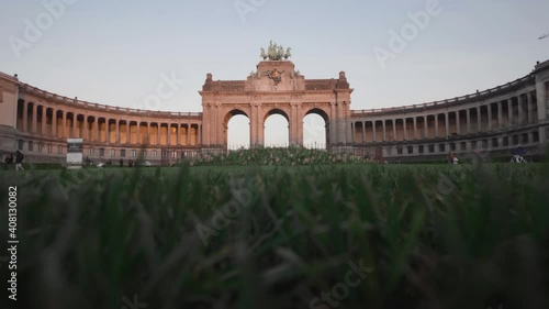 Low wide shot in the grass of the triple Triumphal Arch in Parc du Cinquantenaire (Jubelpark) in Brussels, Belgium photo