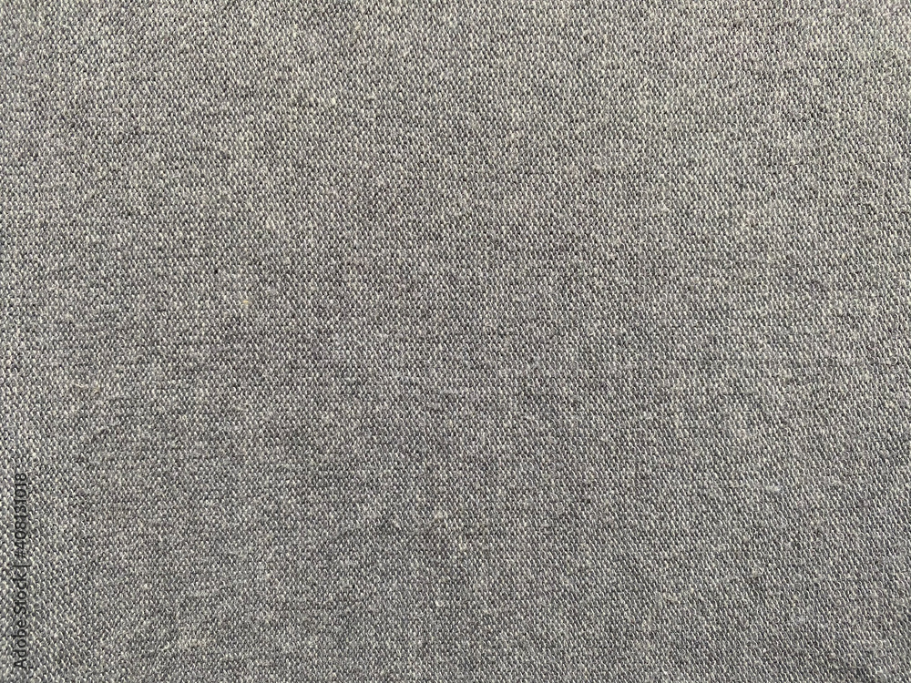 Fototapeta premium Grey fabric and fine knitting. Material for clothes.