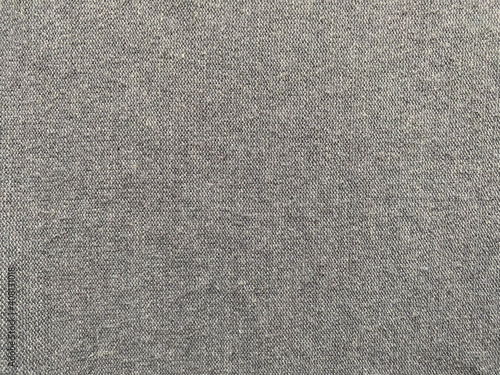 Grey fabric and fine knitting. Material for clothes.