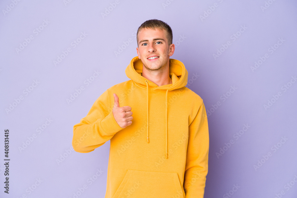 Young caucasian handsome man smiling and raising thumb up Young caucasian handsome man smiling and raising thumb up