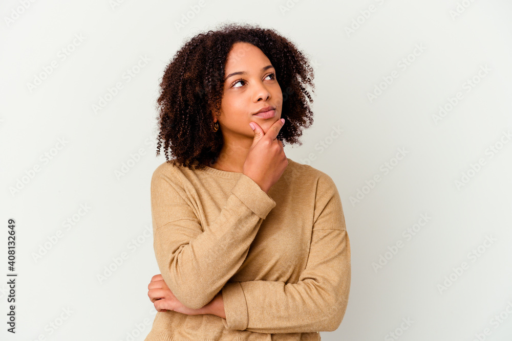Young african american mixed race woman isolated looking sideways with doubtful and skeptical expression.