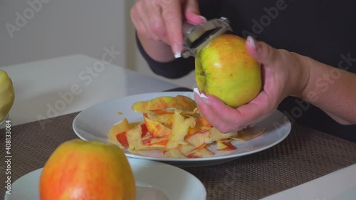 Woman peel apple 