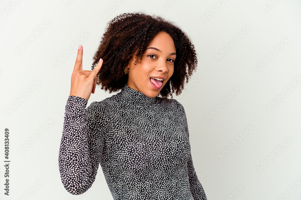 Young african american mixed race woman isolated showing rock gesture with fingers Young african american mixed race woman isolated showing rock gesture with fingers