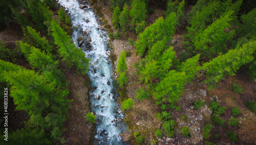 drone fly air view on a small river and trees rocks from top photo