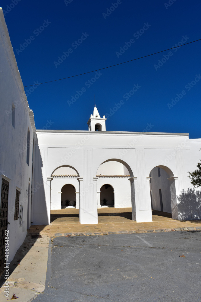 Fototapeta premium Ibiza, Spain - January 17, 2021: Ibiza San Miguel Sant Miquel de Balansat white Mediterranean church on a sunny day..